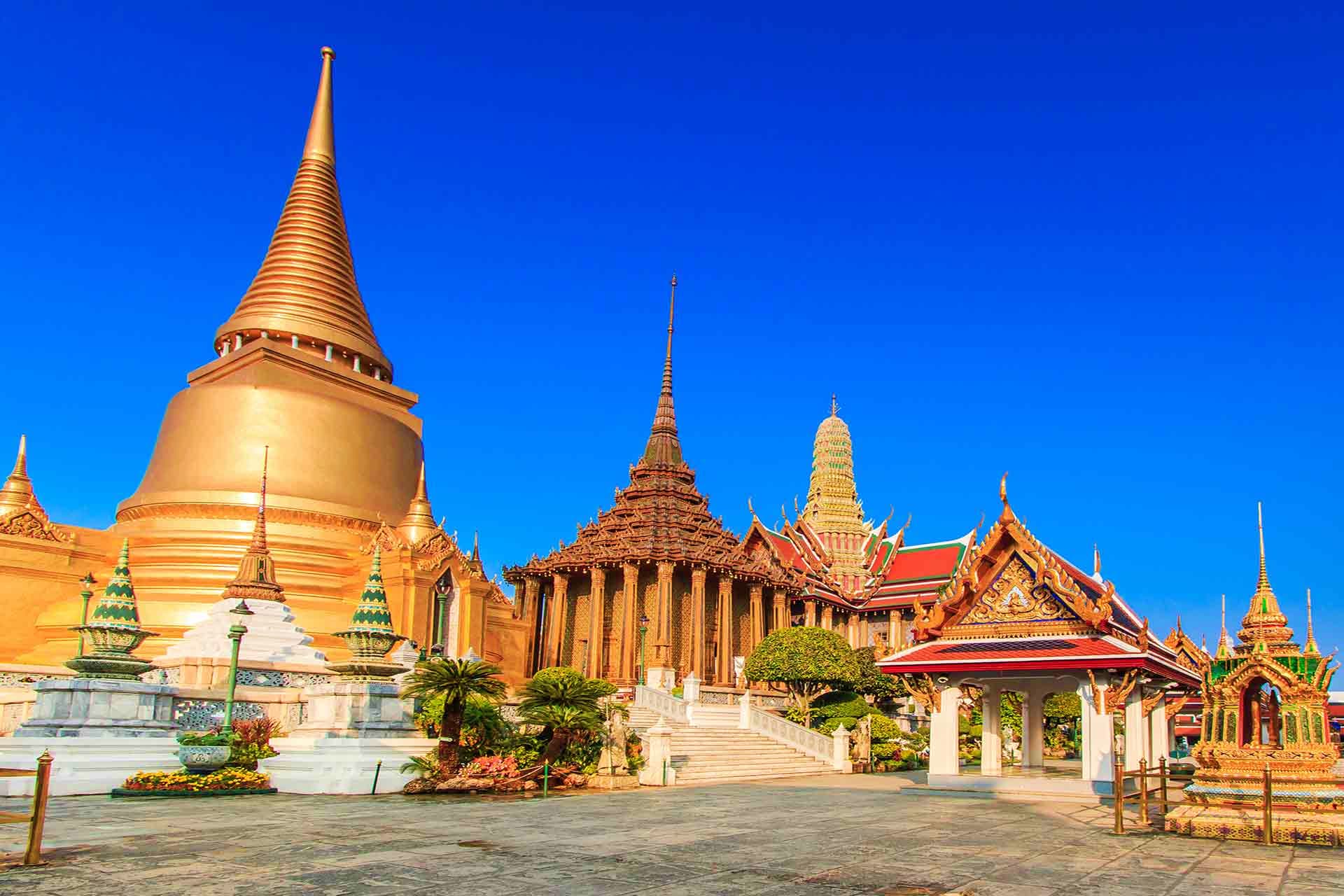Vietnam Visa Grand Palace and Temple of the Emerald Buddha in Bangkok, Thailand with golden stupas and traditional Thai architecture again